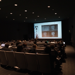 Students in a theater watching the screen